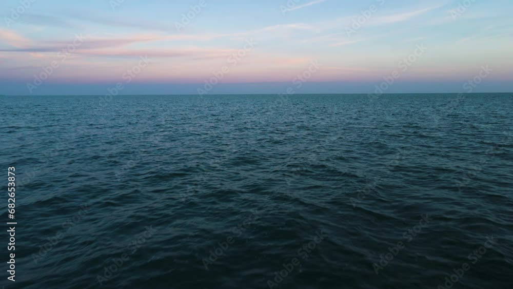Sky seamlessly blends into ocean water ripples, zen calming nature background of water Sky seamlessly blends into ocean water ripples, zen calming nature background of water