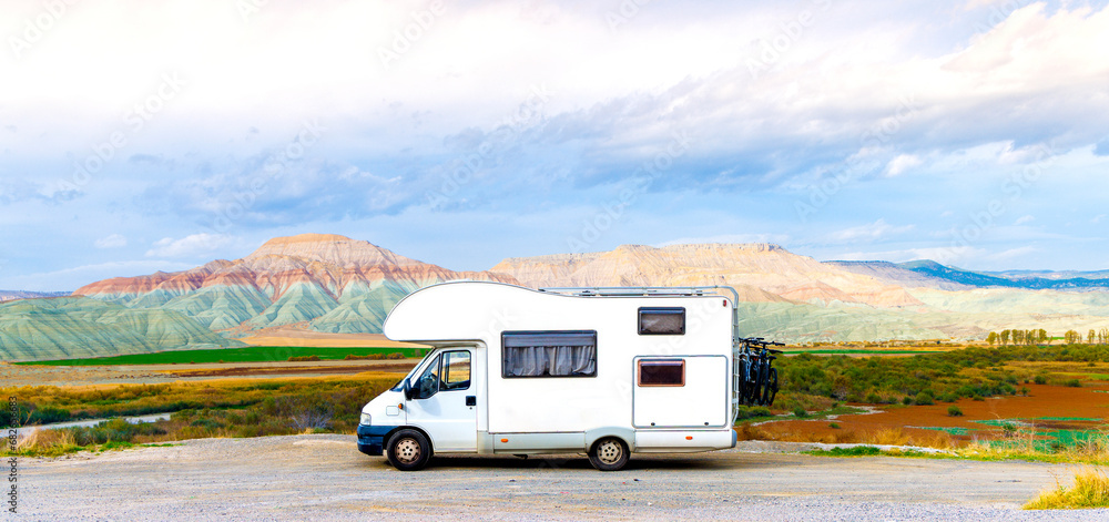 Camper parked at colored mountain in Turkey