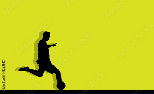 Soccer player silhouette isolated on a green background