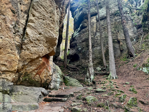 Autumn sunny day. Bohemian Switzerland National Park, Czech Republic. High stone cliffs and trees.  photo