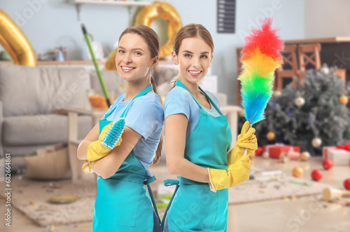 Female janitors on white ba...