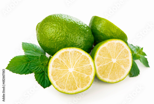 Half of lime citrus fruit. Lime cut isolated on white