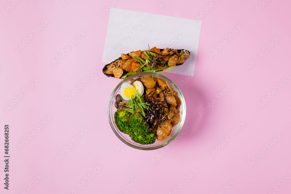 Φωτογραφία The image features a couple of bowls of healthy food against a pink pastel background