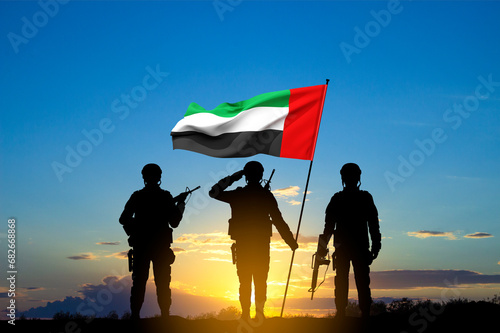 Silhouettes of soldiers with the flag of UAE against the sunset. Armed forces of United Arab Emirates. Concept for Commemoration Day, Martyrs Day, National Day.. 3d-rendering