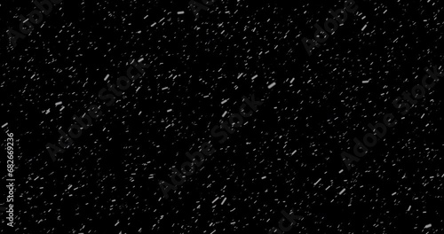 4K Cinematic snowfall loop animation of a surreal realistic snowflake falling bg. Snowfall winter overlay slowly falling motion graphic on a black backdrop.Snow flake for Christmas new year 2024,2025. photo