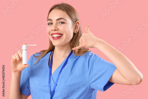 Female doctor with spray bo...