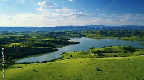 a body of water surrounded by grass and hills