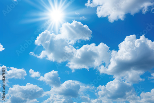 Background of blue sky and white clouds with the sun