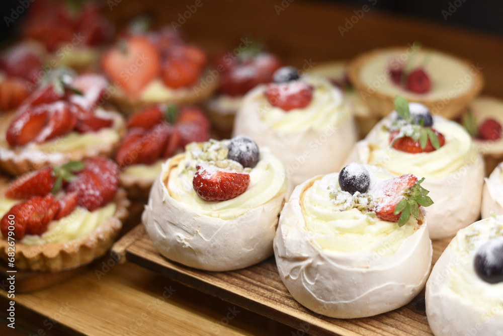 Cakes with cream and strawberries
