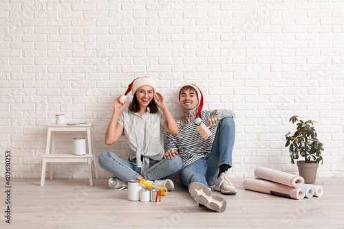 Young couple with Santa hat...