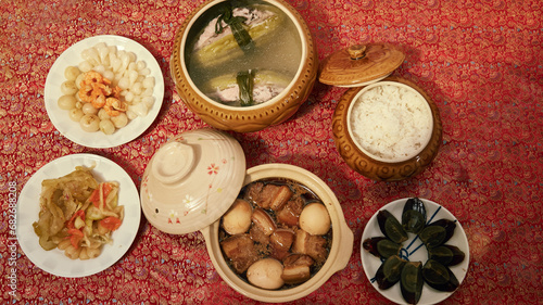 Amazing of Vietnamese food for Tet holiday in spring, it is traditional food on lunar new year: pork belly with hard-boiled eggs braised in coconut water, mixed pickles, rice