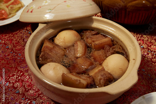 Thit Heo Kho Trung - Vietnamese caramelised pork belly with hard-boiled eggs braised in coconut water. photo