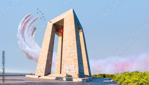 Air Force aerobatic team performing demonstration flight over Canakkale Martyrs' Memorial against to Dardanelles Strait -  (Çanakkale) Canakkale, Turkey photo