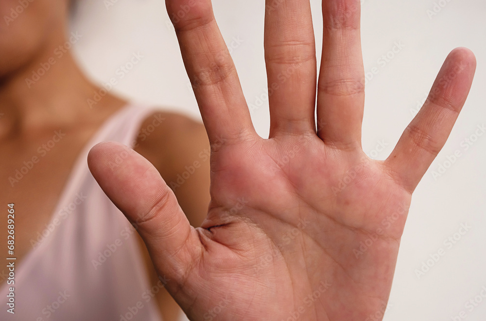 Female making stop gesture, close up. Female making stop gesture, close up.