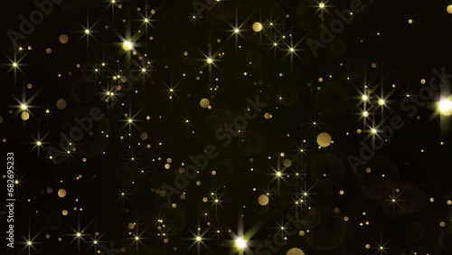 Looping video gold star glow particles background. Bokeh gold glittering celebration. 4K resolution video 3840x2160 photo