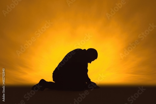 Christian prayer. Man on his knees praying on sunset background. Kneeling prayer to God. Worship and praise. © jchizhe