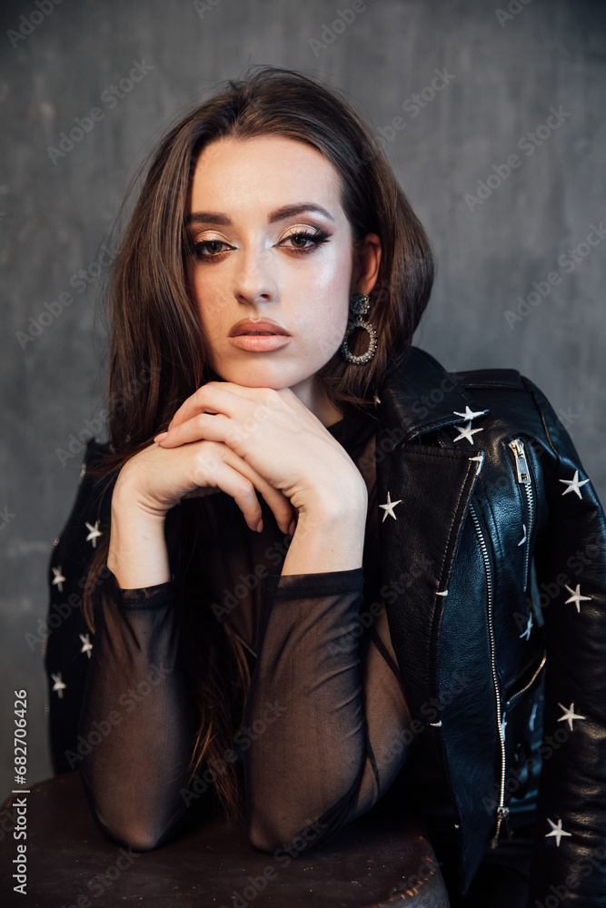 Portrait of fashionable young woman in dark stylish clothes Portrait of fashionable young woman in dark stylish clothes