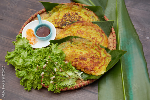 banh xeo delicious traditional food in Vietnam Made from rice flour, water and turmeric powder or coconut milk Crispy Vietnamese Pancakes Stuffed with lard shrimp and bean sprouts, then fried in a pan