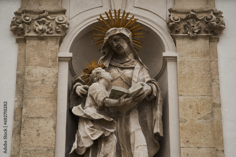 Statue of Saint Anne with a Virgin Mary on a church facade (Hungarian: Felsővízivárosi Szent Anna-plébánia). Budapest, Hungary - 7 May, 2019