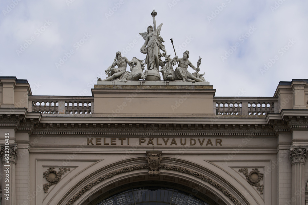 Keleti railway station (Hungarian: Keleti Palvaudvar) entrance arch decorated with statues. Budapest, Hungary - 7 May, 2019