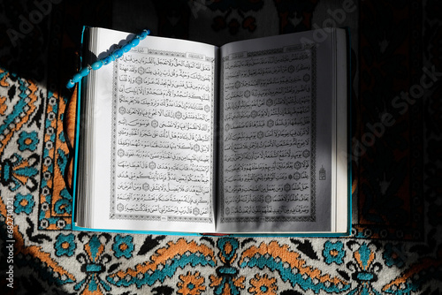 Photography Kuran on a prayer mat