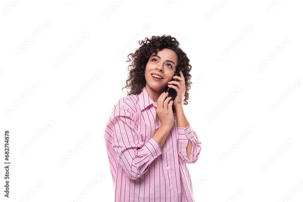 young kind charming caucasian leader woman with black wavy hair speaks on the phone young kind charming caucasian leader woman with black wavy hair speaks on the phone