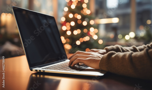 person working on laptop in Christmas time
