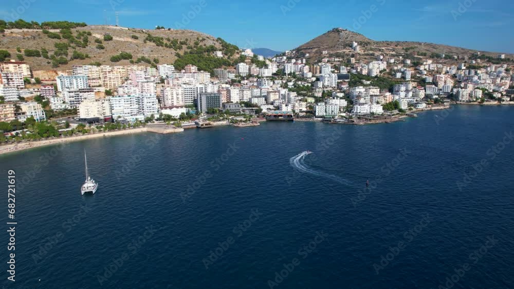 Summer Bliss: Embracing the Azure Beauty of Saranda's Coastal City, a Prime Tourist Destination with a Deep Blue Sea backdrop Summer Bliss: Embracing the Azure Beauty of Saranda's Coastal City, a Prime Tourist Destination with a Deep Blue Sea backdrop