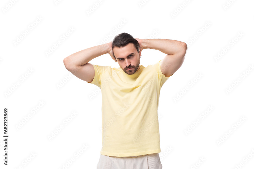 well-groomed young caucasian man with black hair and beard dressed in a t-shirt well-groomed young caucasian man with black hair and beard dressed in a t-shirt