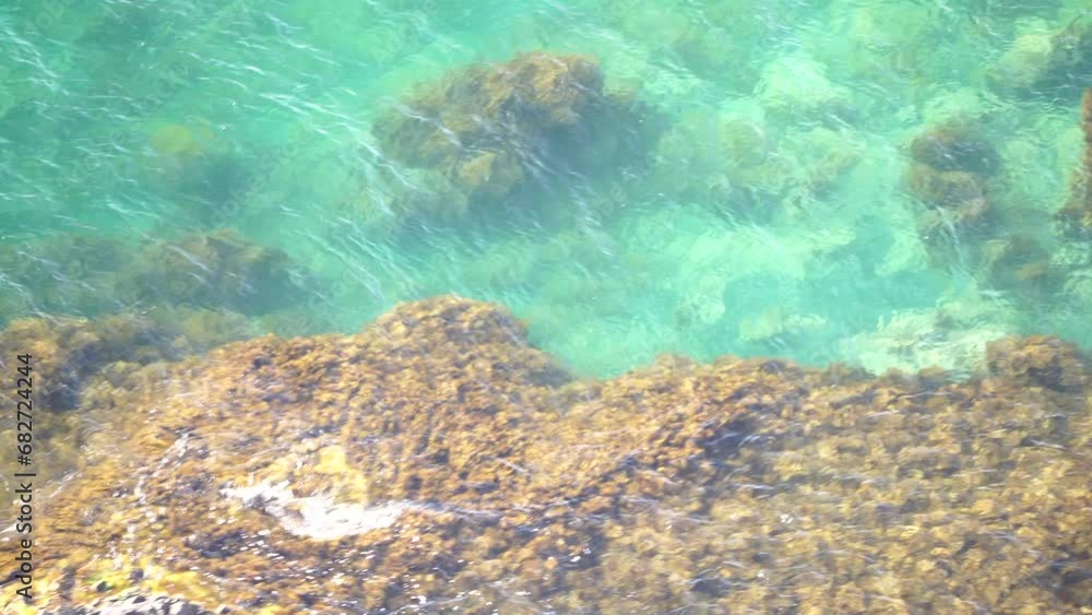 Aerial view on calm azure sea and volcanic rocky shores. Small waves on water surface. Nature summer ocean sea beach view. Nobody. Holiday, vacation and travel concept. Weather and climate change Aerial view on calm azure sea and volcanic rocky shores. Small waves on water surface. Nature summer ocean sea beach view. Nobody. Holiday, vacation and travel concept. Weather and climate change