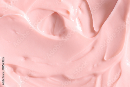 Pink skin care cosmetic beauty cream texture background in close up