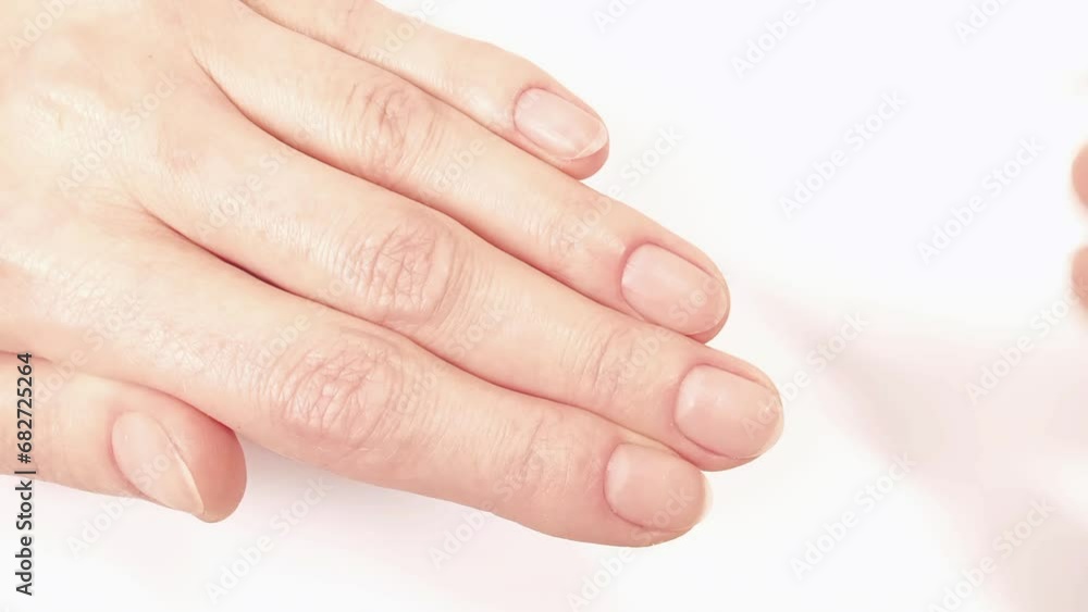 Pushing back cuticles with a nail pusher. Double-sided cuticle tool help gently push cuticles back from the nail surface so nails stay healthy and beautiful. At-Home manicures Pushing back cuticles with a nail pusher. Double-sided cuticle tool help gently push cuticles back from the nail surface so nails stay healthy and beautiful. At-Home manicures