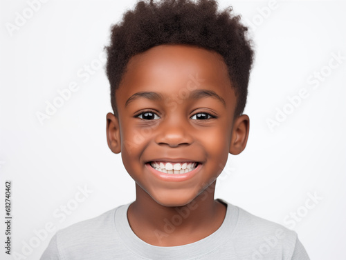 Beautiful little afro boy laughing. Full mouth smile. Isolated on white background 