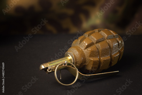 Hand grenade on a dark background photo