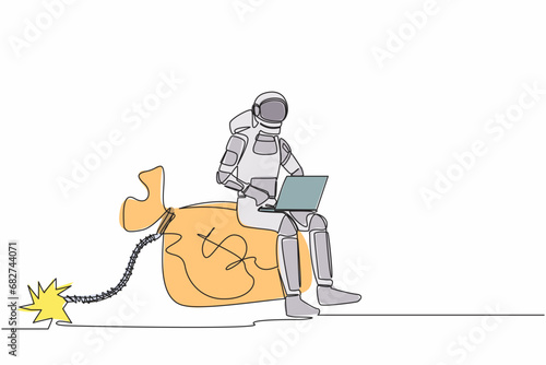 Continuous one line drawing of astronaut sitting and typing laptop on huge bomb money bag with burning fuse. Deadline to finish spaceship funding. Cosmonaut outer space. Single line draw design vector