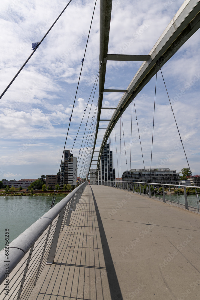 Obraz premium 3 state bridge over the Rhine between Germany and France with a view of the Huningue skyline