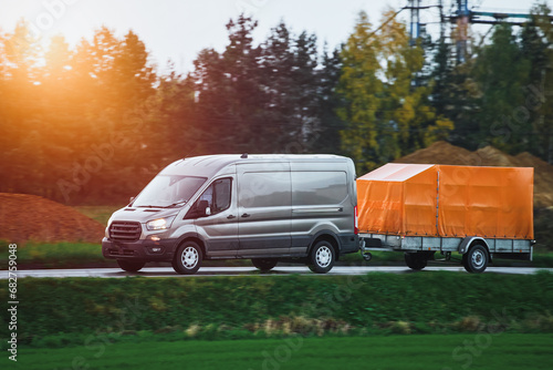 Wallpaper Mural A Car and a Rental Trailer on a Curvy Road. A Smart Way to Move Your Stuff. Transporting Cargo with a Car and a Trailer. A Convenient and Cost-Effective Solution. Torontodigital.ca