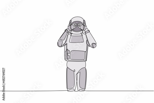 Single one line drawing astronaut standing with covering his eyes with hands because of disgust and reluctance to see something. Cosmic galaxy space. Continuous line graphic design vector illustration