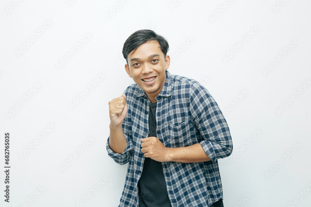 Portrait Asian Indonesian young man dancing gesture isolated white background Portrait Asian Indonesian young man dancing gesture isolated white background
