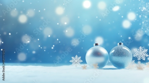 two silver and blue ornaments on snow