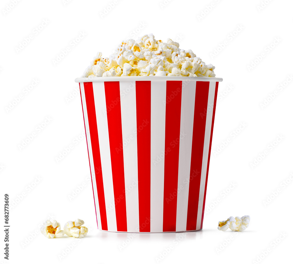 Popcorn in red and white striped paper bucket isolated on white background