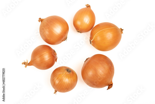 Yellow unpeeled onions on a white background