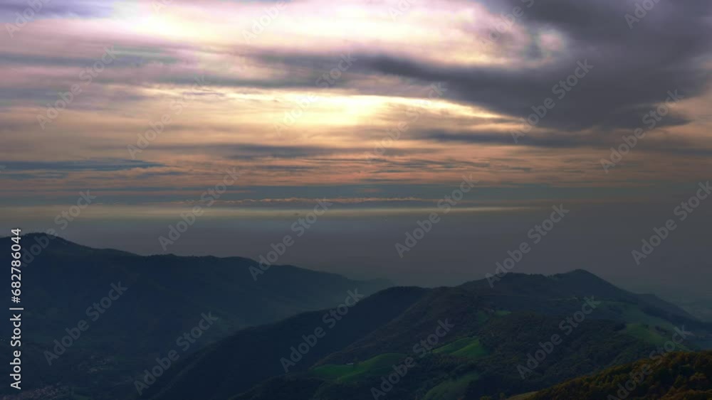 Aerial View over Beautiful Mountainscape over Mountain Valley with Cloudy Sky with Sunlight in Ticino, Switzerland. Aerial View over Beautiful Mountainscape over Mountain Valley with Cloudy Sky with Sunlight in Ticino, Switzerland.
