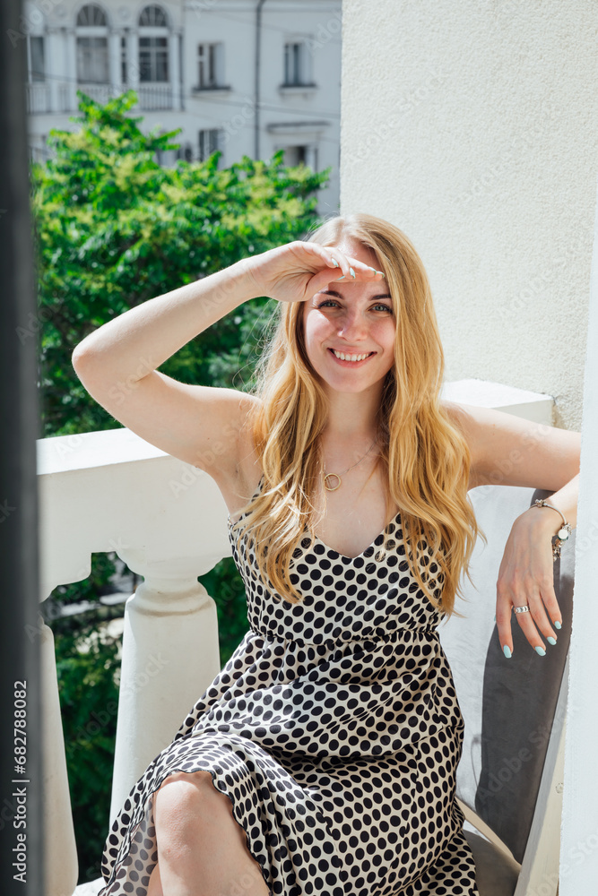 Beautiful blonde woman in polka dot summer dress Beautiful blonde woman in polka dot summer dress