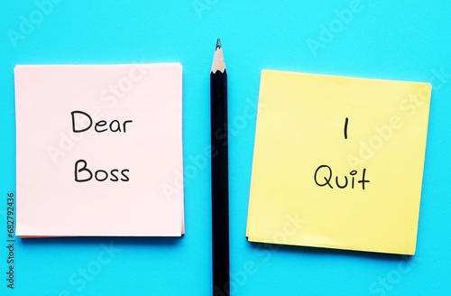 On blue background, pencil wrote on office notes DEAR BOSS I QUIT, concept of employee decides to leave work, quitting full time job - the great resignation