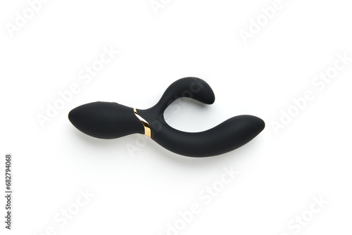 Black vibrator on the white background. Sex toys for adults. Flat lay, top view
