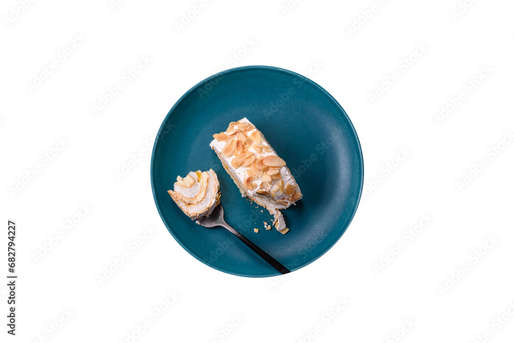 A piece of delicious sweet meringue roll with mascarpone cheese, berries and almonds A piece of delicious sweet meringue roll with mascarpone cheese, berries and almonds