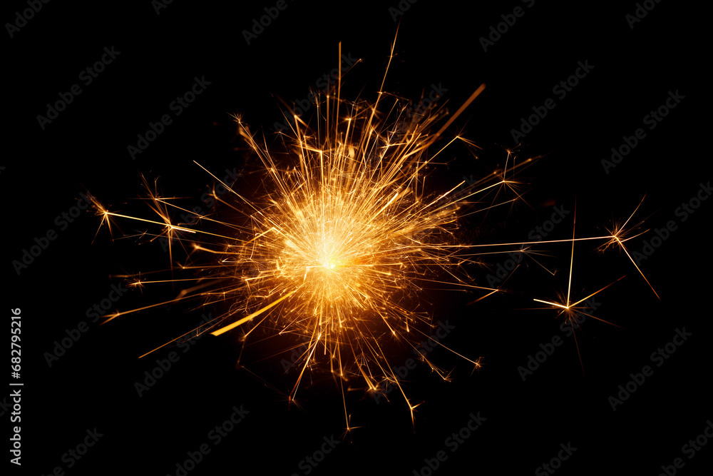 close up of burning sparkler against black background