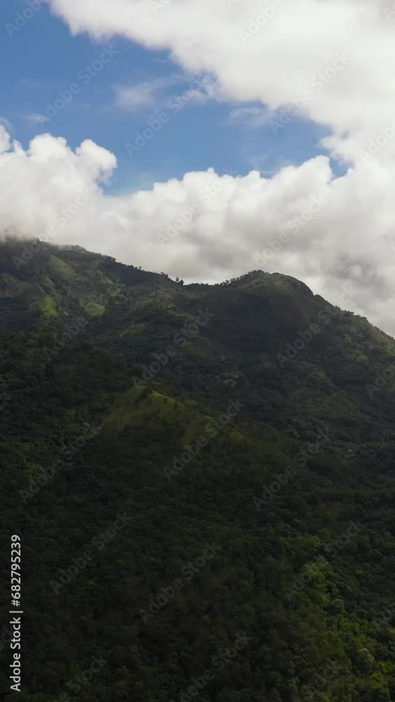 Aerial view of Tropical mountain range and mountain slopes with rainforest. Sri Lanka. Aerial view of Tropical mountain range and mountain slopes with rainforest. Sri Lanka.