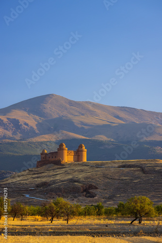 La Calahorra castle with Sierra Nevada, Andalusia, Spain photo